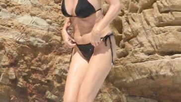 Heather Graham Slips Into a Black Bikini for a Beachside Frolic Next to a Mystery Man (35 Photos)