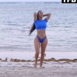 Kim Kardashian Shows Off Her Sensational Curves on the Beach (15 Photos)