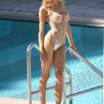 Charlotte McKinney Stuns in an Array of Racy Outfits During Glamorous Poolside Shoot in Miami Beach (14 Photos)